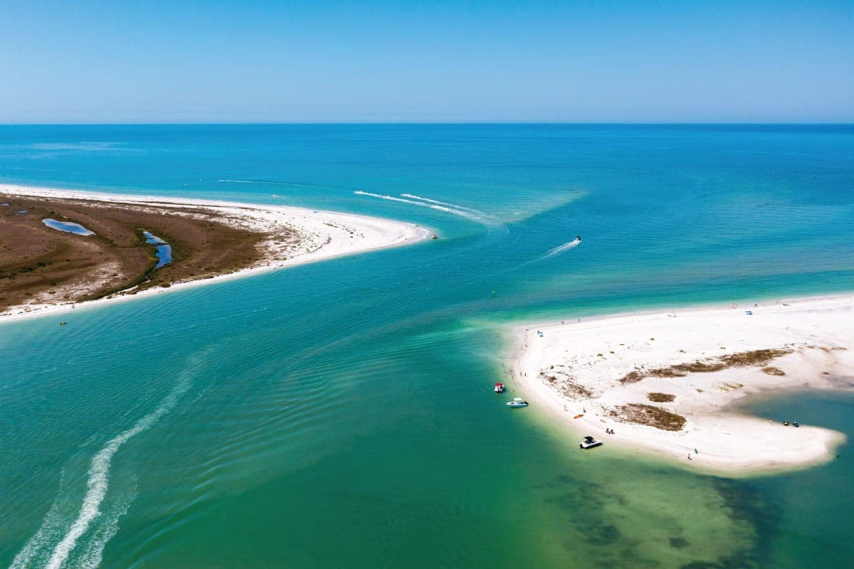 Aerial view of the pass and white-sand shoreline at Caladesi Island near Clearwater Beach